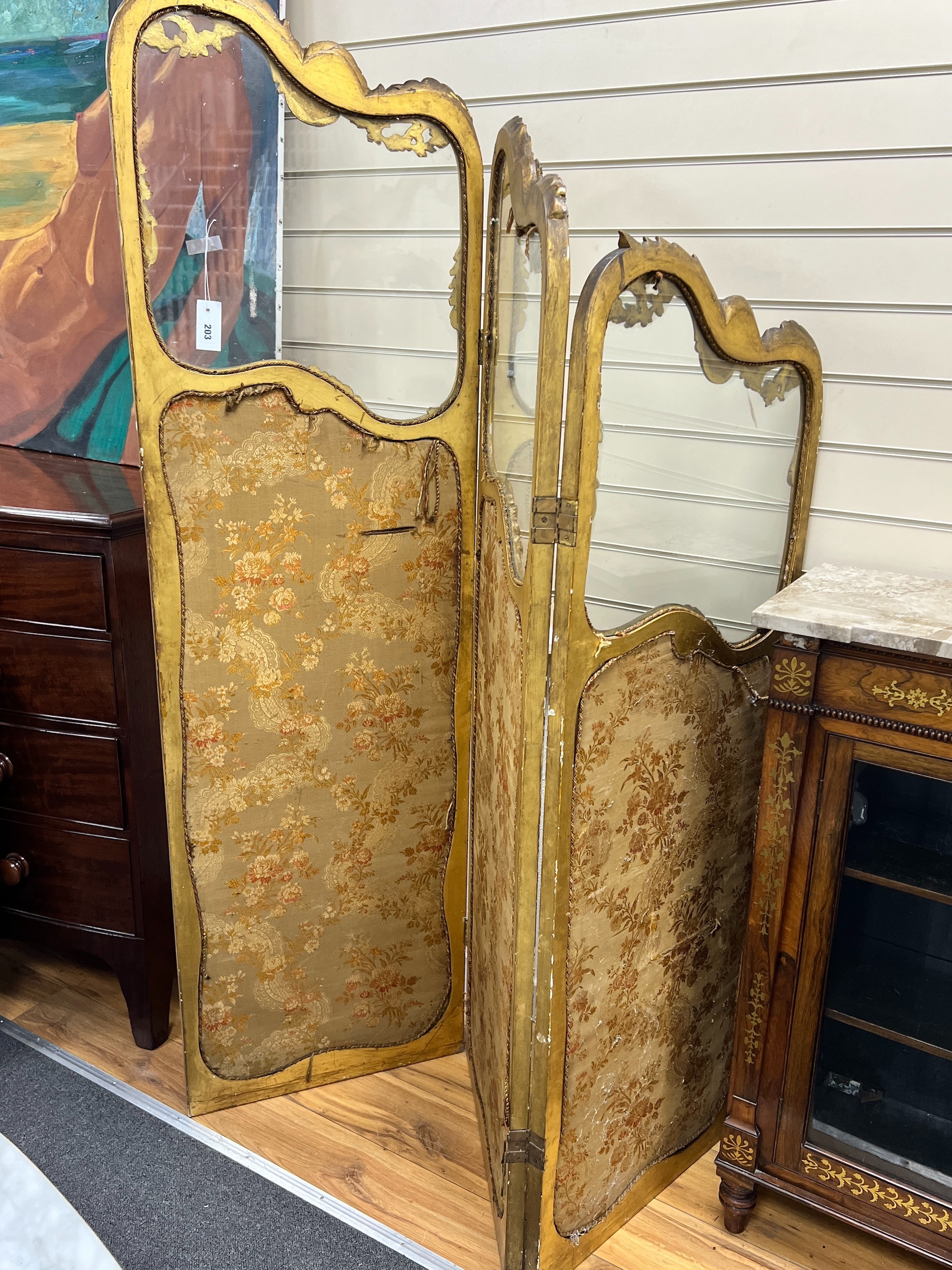 A Louis XV style carved glazed giltwood three fold dressing screen, height 185cm